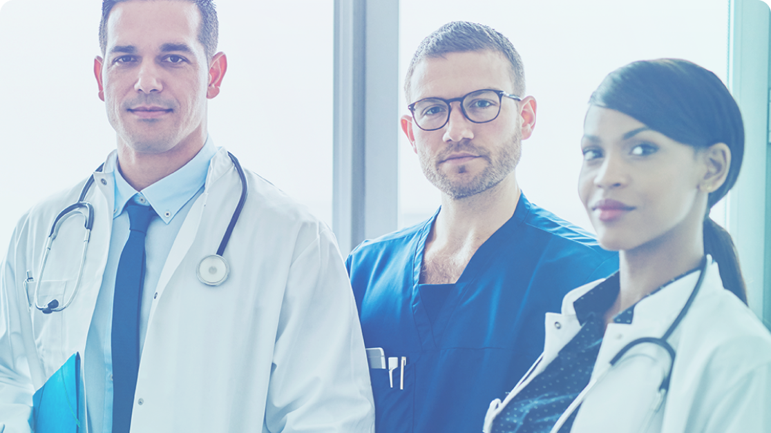 Three healthcare professionals standing