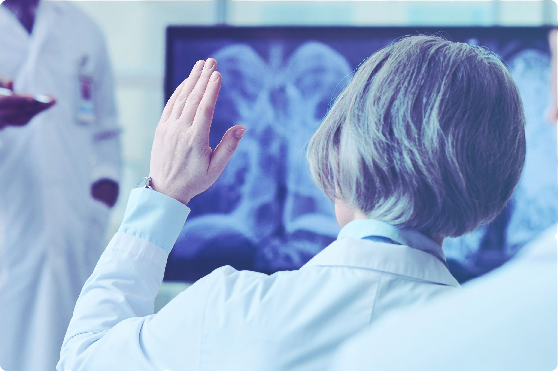 Doctor raising their hand to ask a question